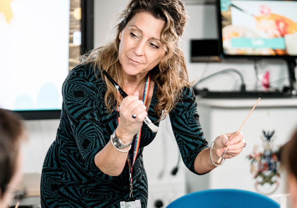 A lecturer leading an Occupational Therapy craft class