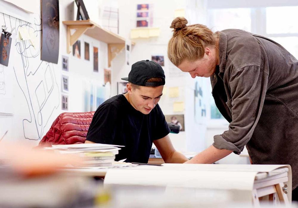 Art studio with tutor and student working together