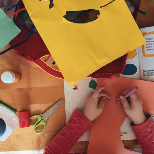 Child using colourful resources at school